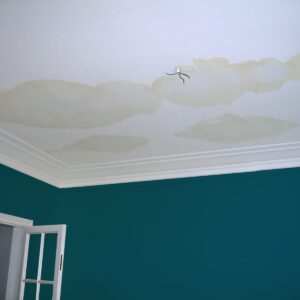 Water stains on a ceiling in a Texas home indicating water damage.