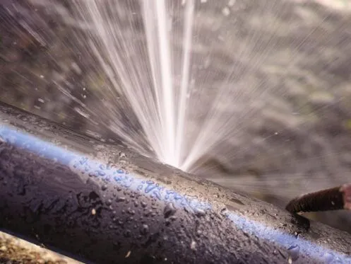 Burst pipe causing water damage in a Texas home during winter.