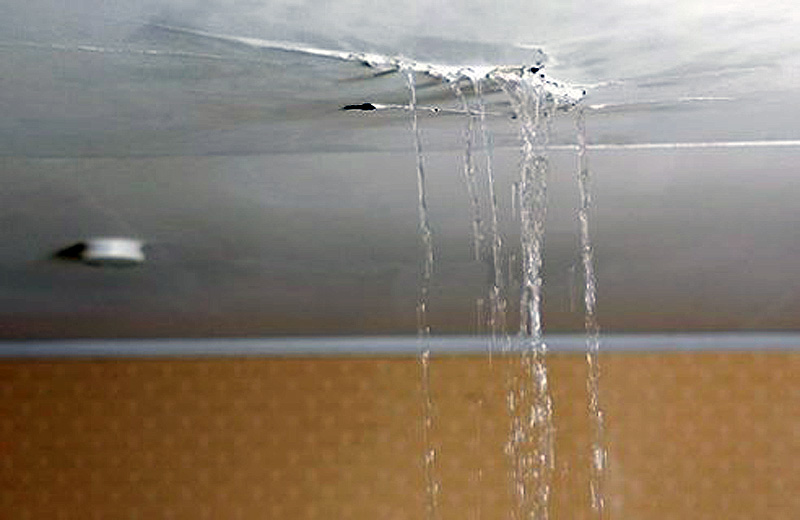 Leaking roof with visible water stains in a DFW home.