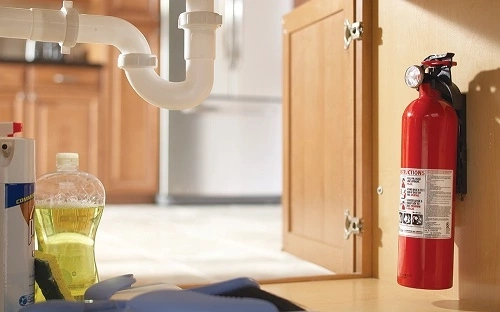 Fire extinguisher mounted on the wall of a Texas home.